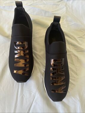DKNY Black Slip-On Sneakers with Metallic Bronze Logo